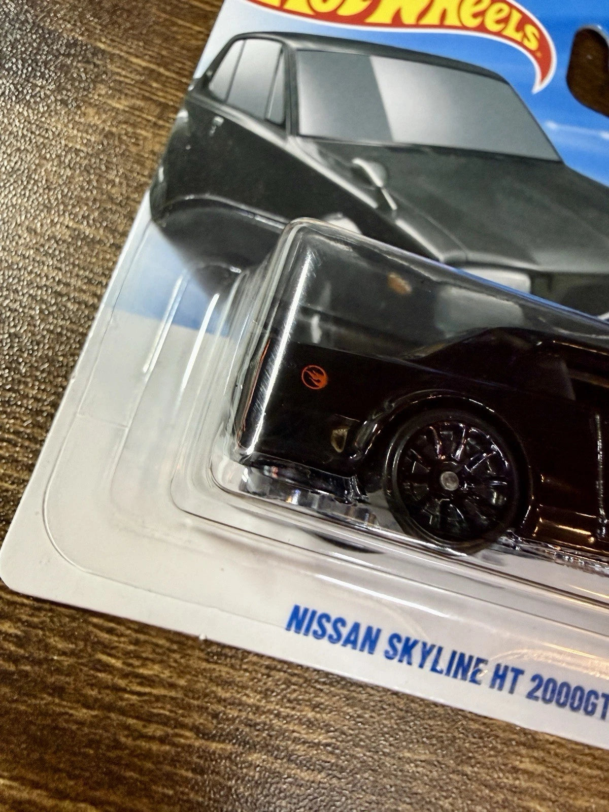 More Than Diecast Hot Wheels Treasure Hunt Nissan Skyline HT 2000GT-X in black with flame logo on blister card