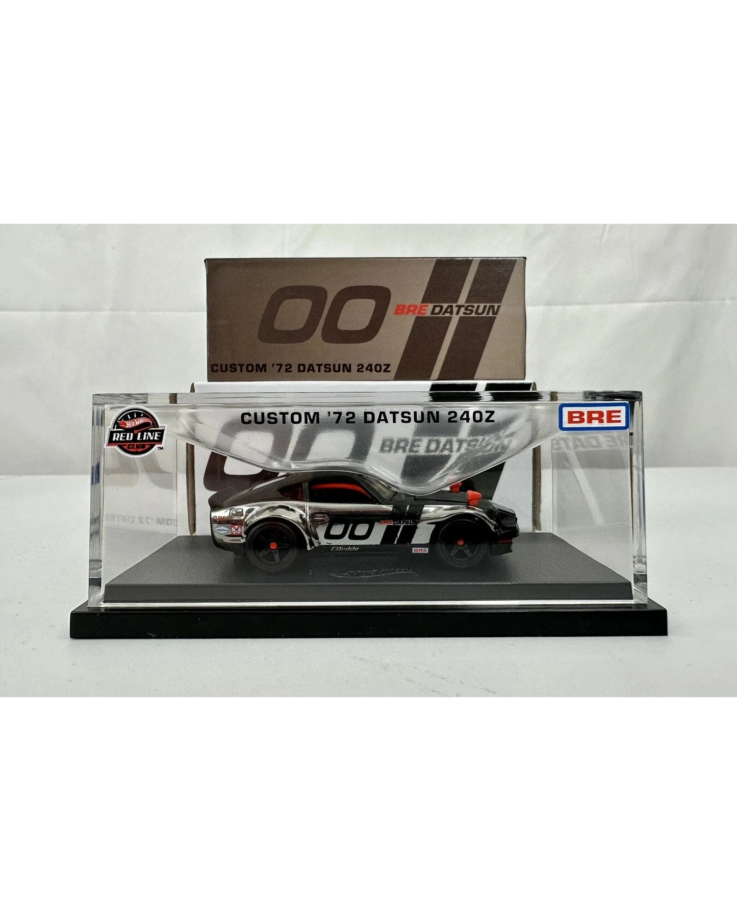 More Than Diecast Hot Wheels RLC Custom 72 BRE Datsun 240Z in a clear display case with iconic racing livery