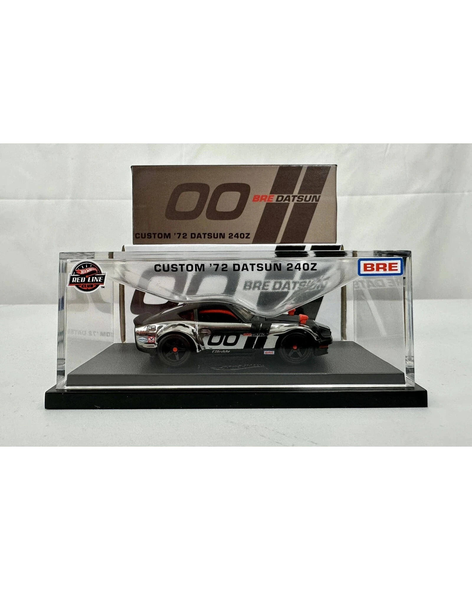 More Than Diecast Hot Wheels RLC Custom 72 BRE Datsun 240Z in a clear display case with iconic racing livery