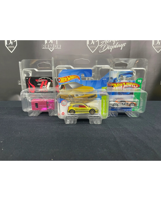 More Than Diecast clear PVC short card protectors displaying various Hot Wheels and Matchbox diecast toy cars