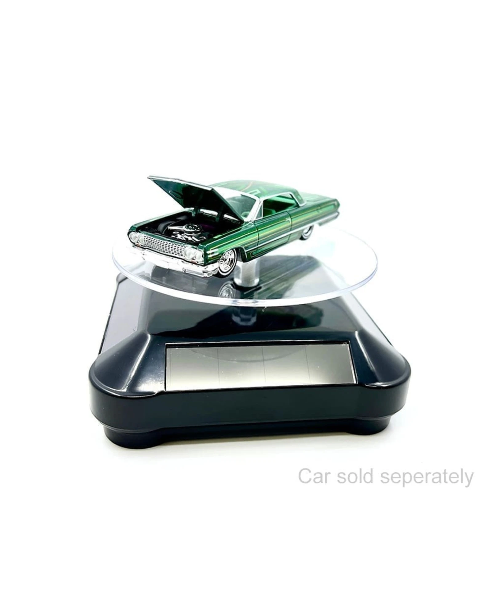 More Than Diecast solar powered 3.5" turntable display stand with black base, showcasing a 1:64 scale green die-cast car with hood open.