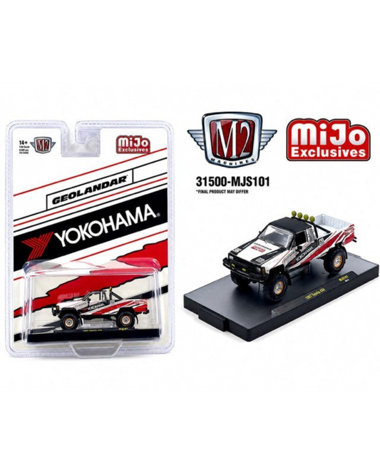 More Than Diecast M2 Machines 1985 Toyota 4x4 pickup in white with Yokohama Geolandar tires in blister packaging.