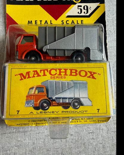 More Than Diecast vintage 1968 Matchbox Ford Refuse Garbage Truck in original packaging with red cab and grey hopper