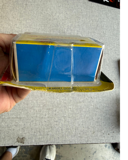 More Than Diecast vintage 1968 Matchbox Ford Refuse Truck in original blister pack packaging, side view