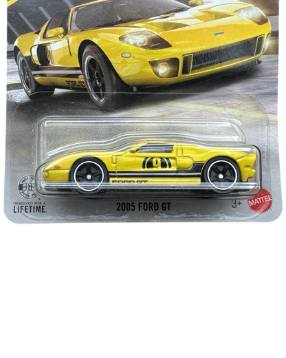 More Than Diecast 1:64 scale yellow 2005 Ford GT die-cast car in original blister pack packaging