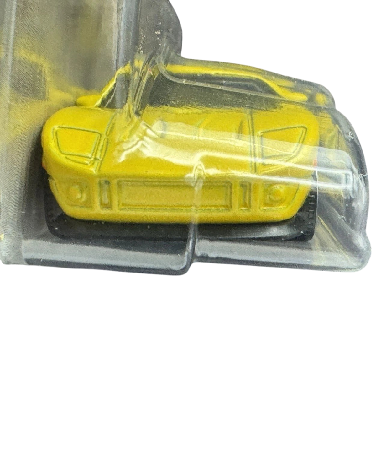 More Than Diecast 1:64 scale 2005 Ford GT die-cast car in bright yellow, front view in original blister packaging.