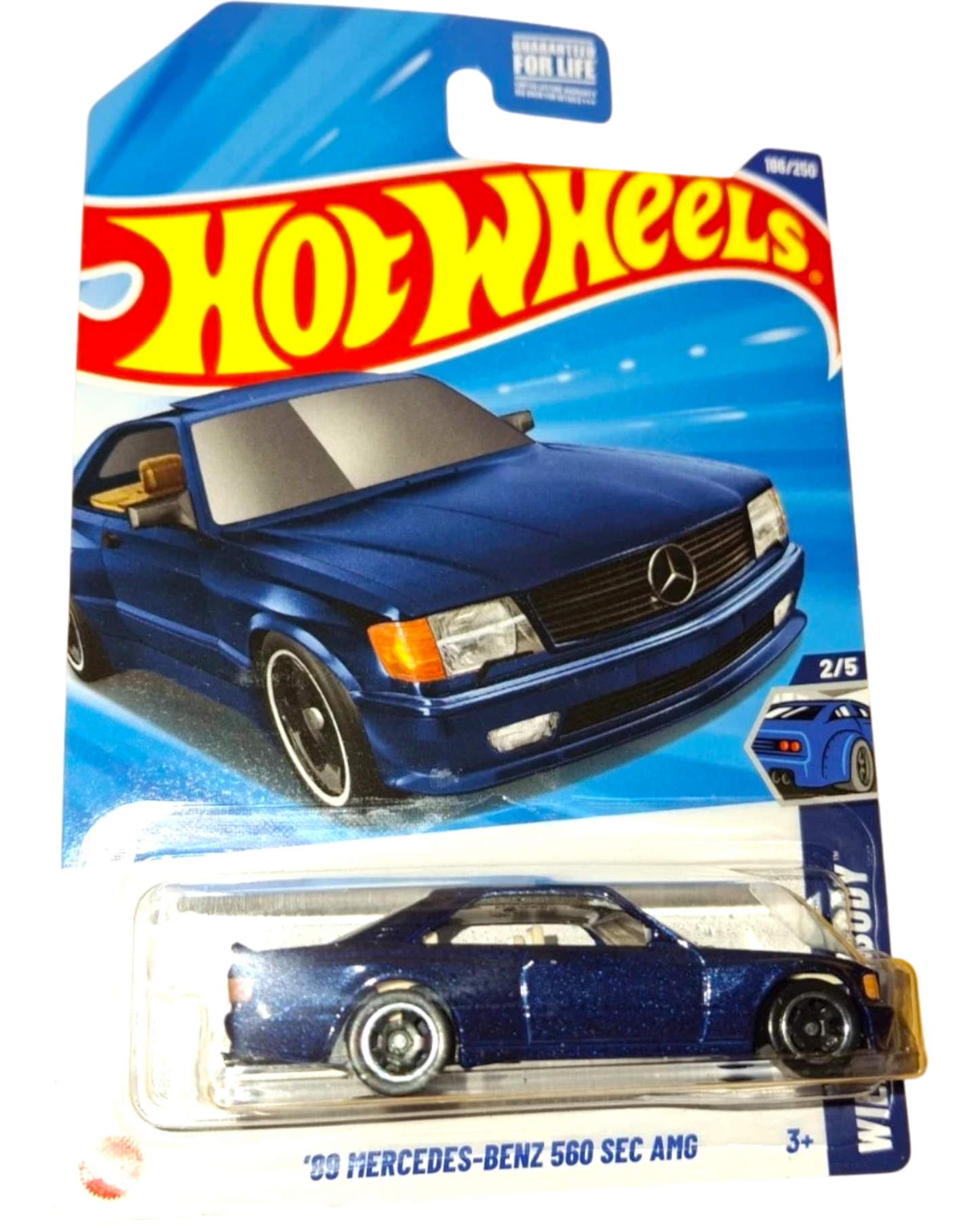 More Than Diecast 2025 Hot Wheels 1989 Mercedes-Benz 560 SEC AMG in metallic blue, die-cast model with AMG styling.