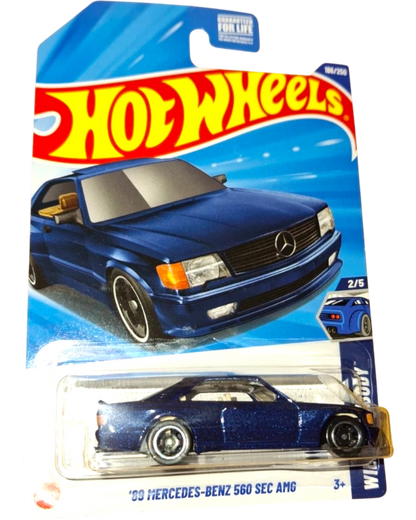 More Than Diecast 2025 Hot Wheels 1989 Mercedes-Benz 560 SEC AMG in metallic blue, die-cast model with AMG styling.