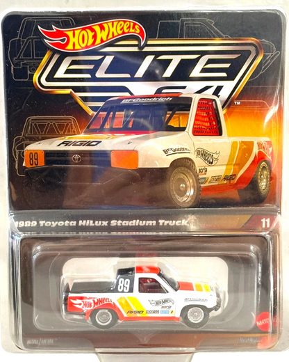 More Than Diecast 1:64 scale 1989 Toyota Hilux Stadium Truck, white with red, orange, and yellow racing stripes, BFGoodrich livery.