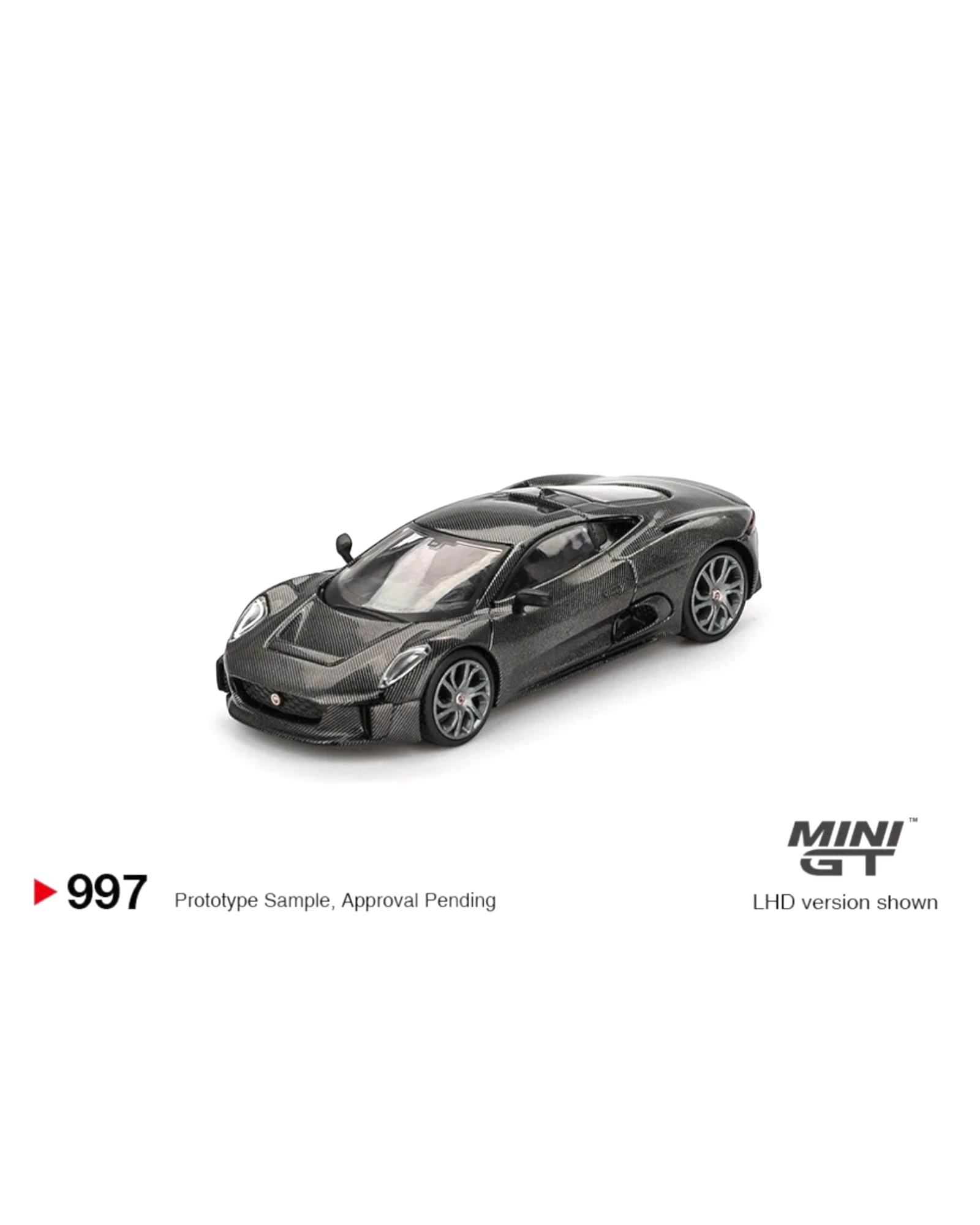 More Than Diecast 1:64 scale black Mini GT Jaguar C-X75 test car die-cast model with carbon fiber finish.