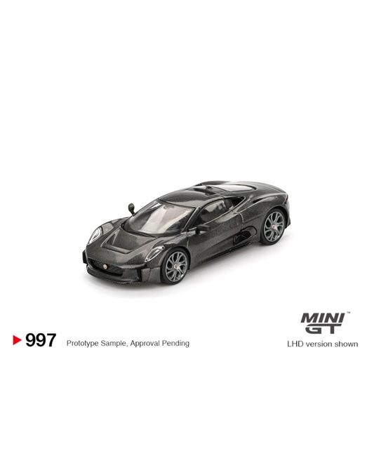 More Than Diecast 1:64 scale black Mini GT Jaguar C-X75 test car die-cast model with carbon fiber finish.