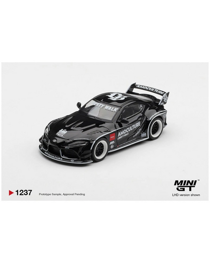 More Than Diecast 1:64 black Toyota GR Supra LB Works AMOCULTURE die-cast model with wide-body kit and racing livery.