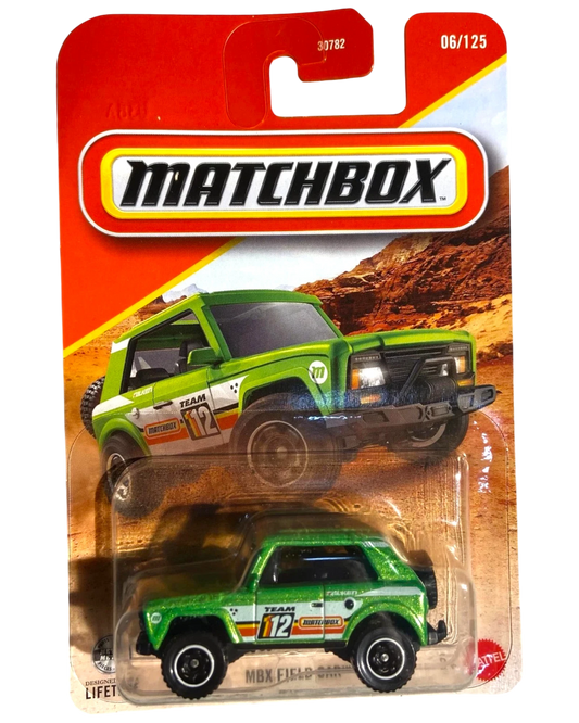 More Than Diecast green 1:64 scale Matchbox MBX Field Car #6 die-cast utility vehicle with white and orange racing stripes.