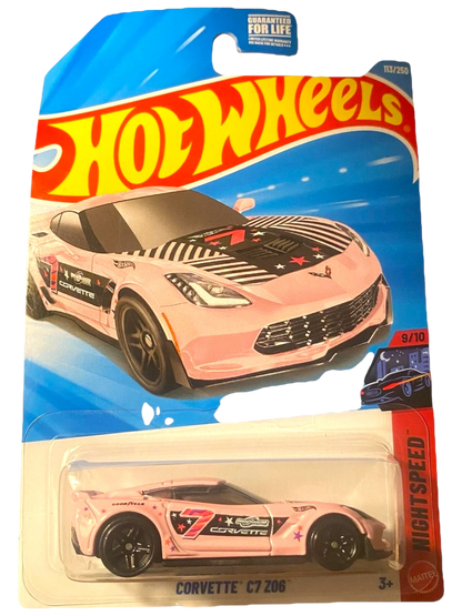 More Than Diecast Hot Wheels Corvette C7 Z06 in pink with black and white racing stripes and star graphics. 1:64 scale die-cast.