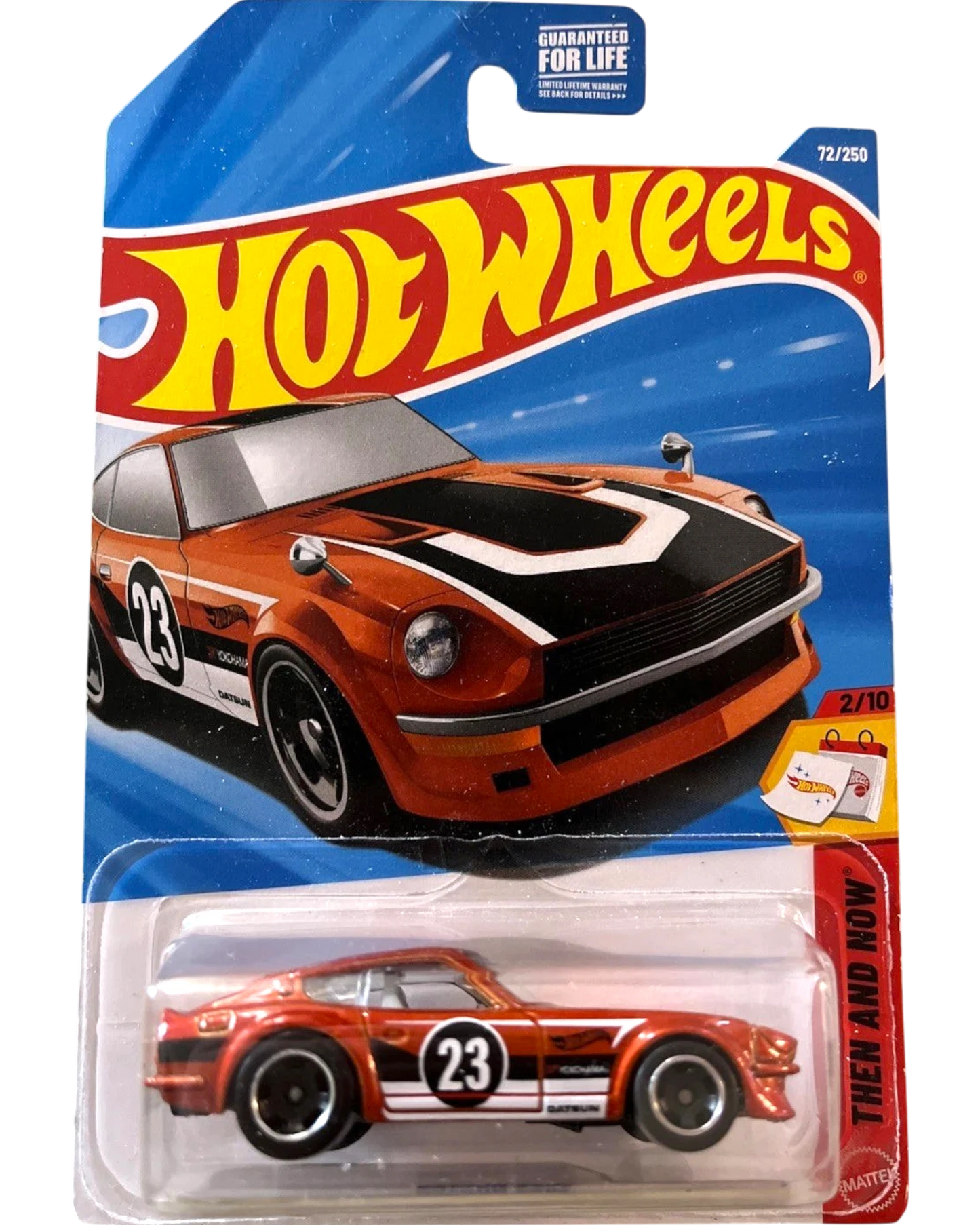 More Than Diecast Hot Wheels 2025 Datsun 240Z JDM die-cast car, orange with black and white racing stripes and number 23.