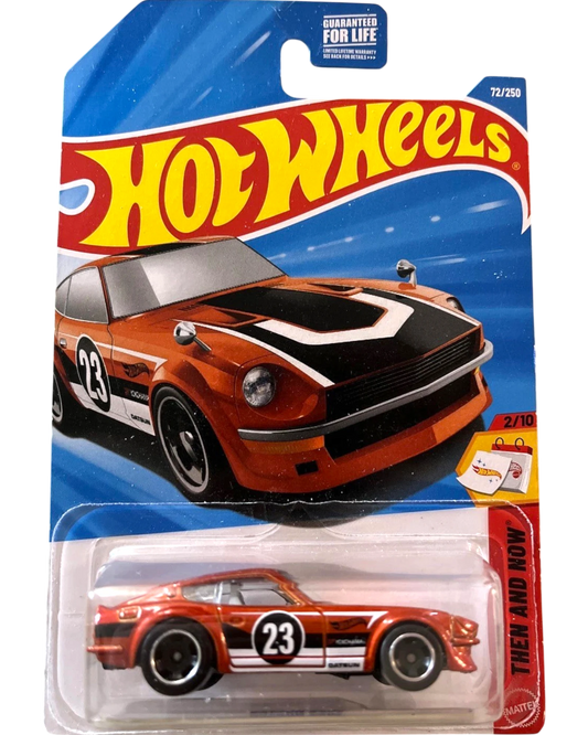 More Than Diecast Hot Wheels 2025 Datsun 240Z JDM die-cast car, orange with black and white racing stripes and number 23.
