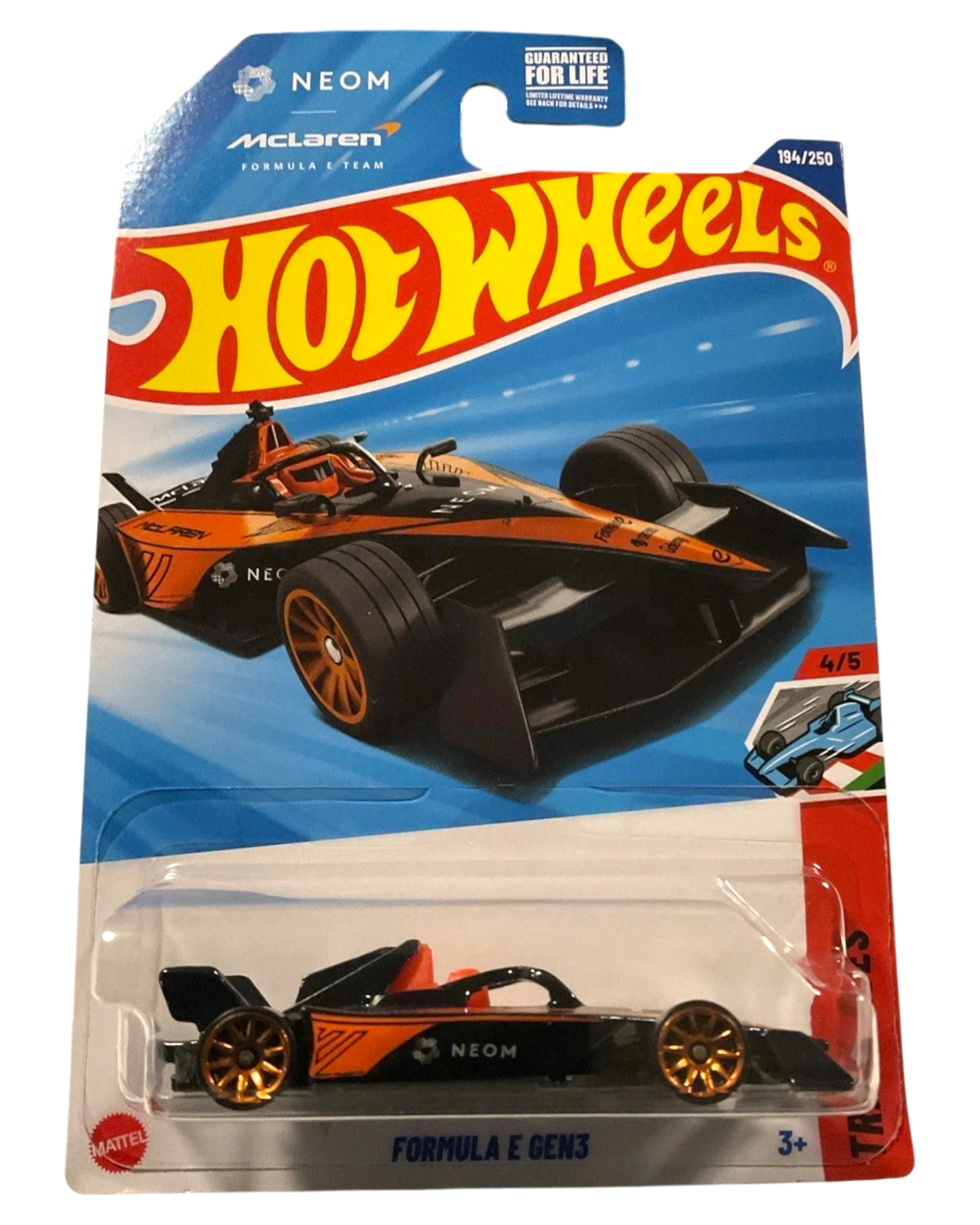 More Than Diecast 2025 Hot Wheels Neom McLaren Formula E GEN3 die-cast car, black with orange accents and gold wheels.