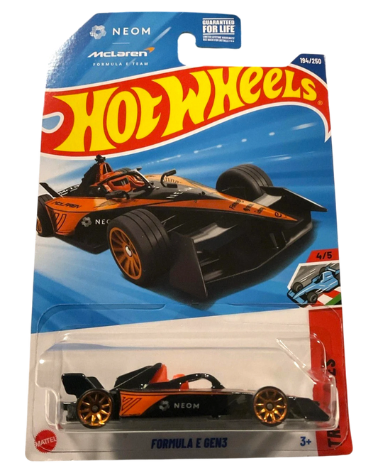More Than Diecast 2025 Hot Wheels Neom McLaren Formula E GEN3 die-cast car, black with orange accents and gold wheels.