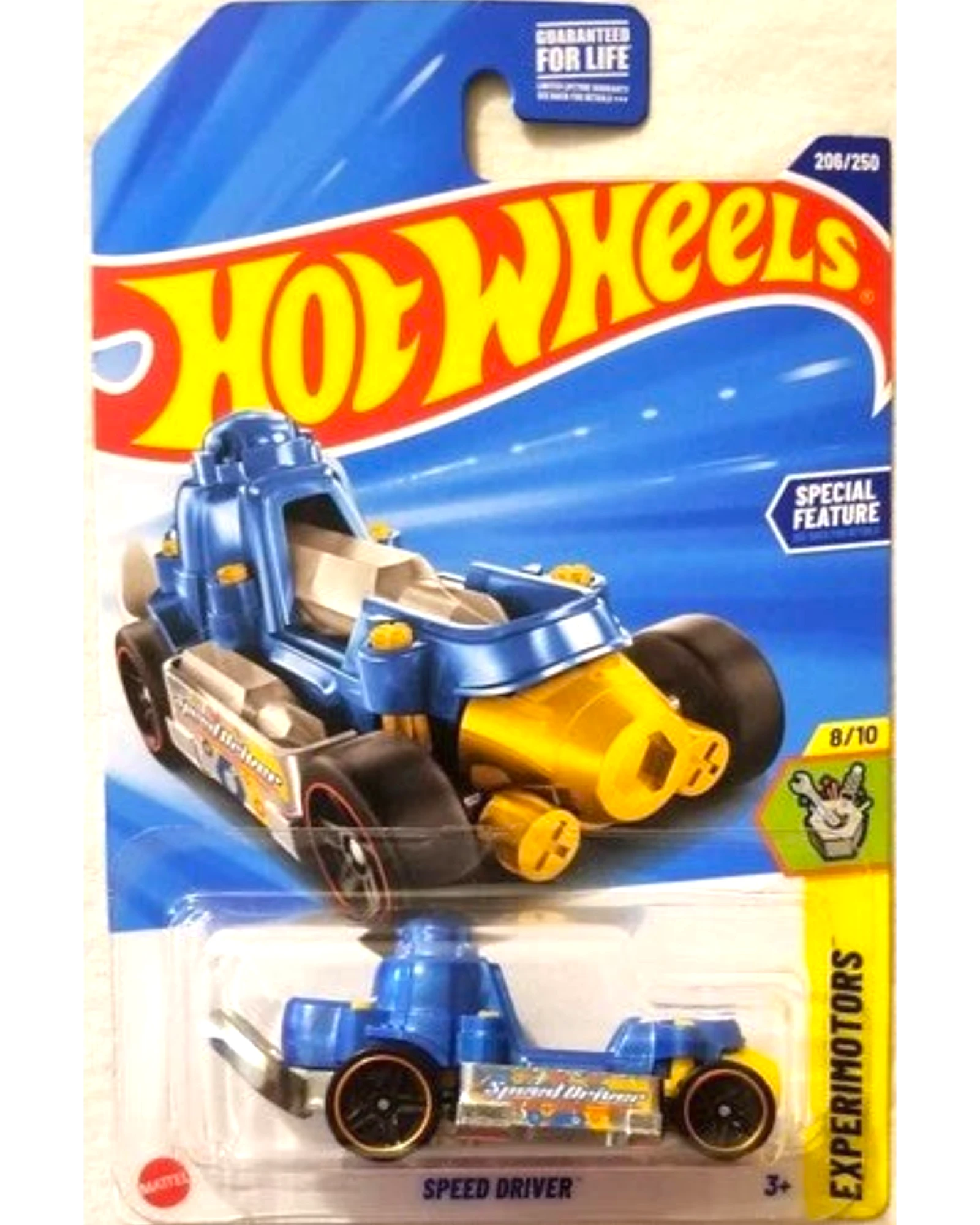 More Than Diecast Hot Wheels 2025 Experimotors Speed Driver toy car, blue and gold die-cast with red-rimmed wheels.