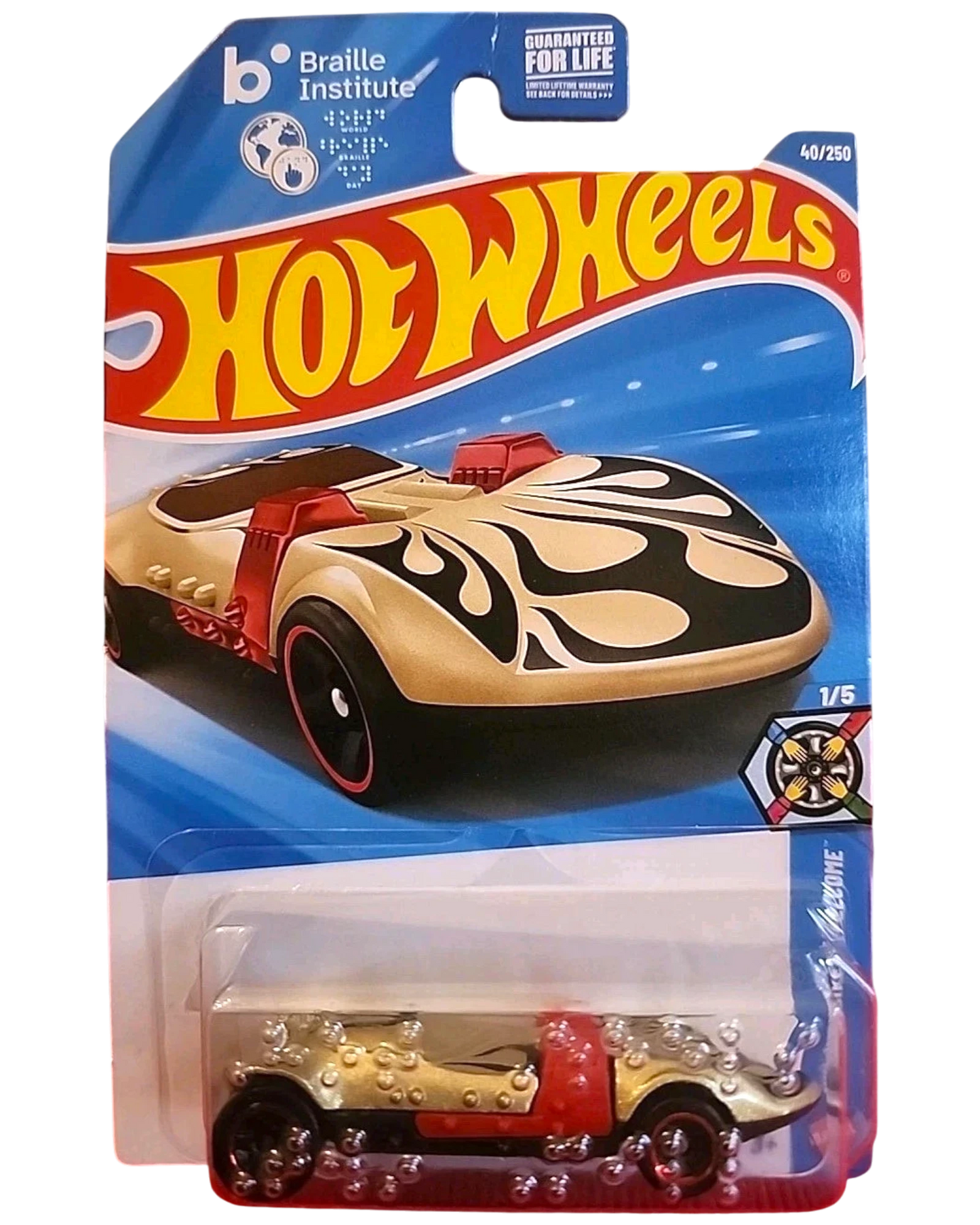 More Than Diecast Hot Wheels 2025 Twin Mill Braille Racer die-cast vehicle, gold with black flames and red accents, 1:64 scale.