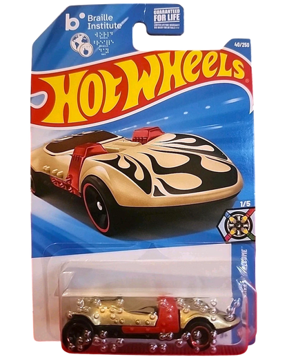 More Than Diecast Hot Wheels 2025 Twin Mill Braille Racer die-cast vehicle, gold with black flames and red accents, 1:64 scale.