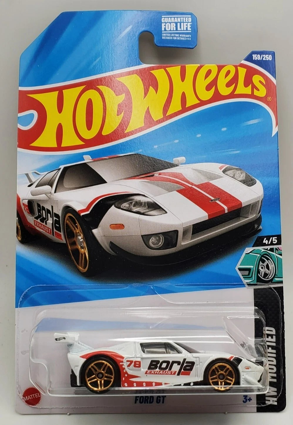 More Than Diecast Hot Wheels White Ford GT HW Modified diecast model car with red racing stripes and gold wheels.