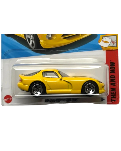 Yellow toy car in packaging with a visible Mattel logo.