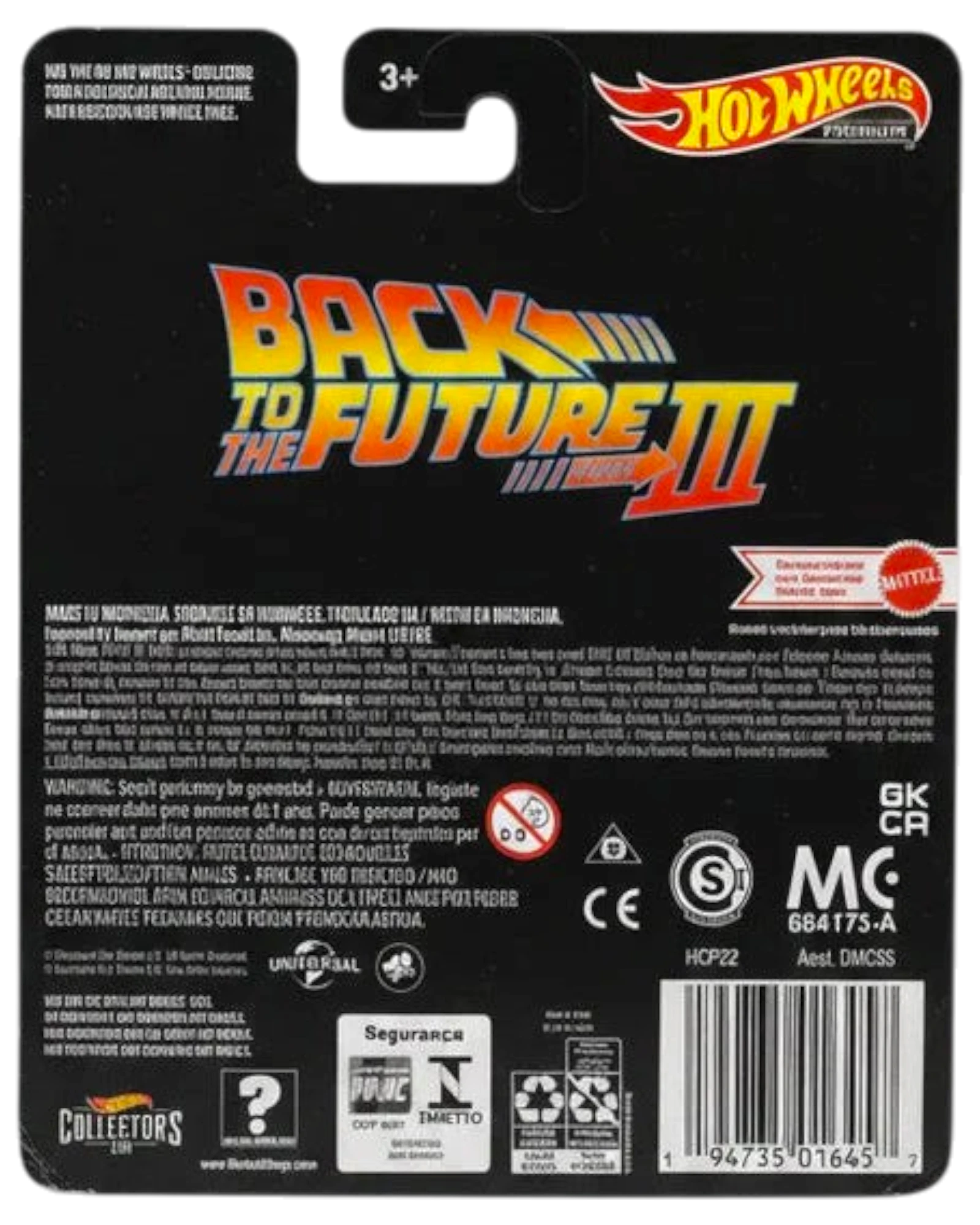 Back of a Hot Wheels toy packaging with 'Back to the Future III' branding on a wooden surface.