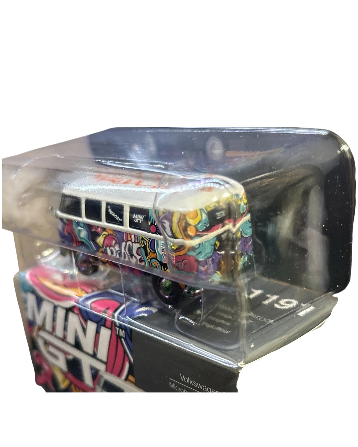 More Than Diecast 1/64 scale Volkswagen Bus chase model with Mizu design, featuring white and yellow graffiti art.